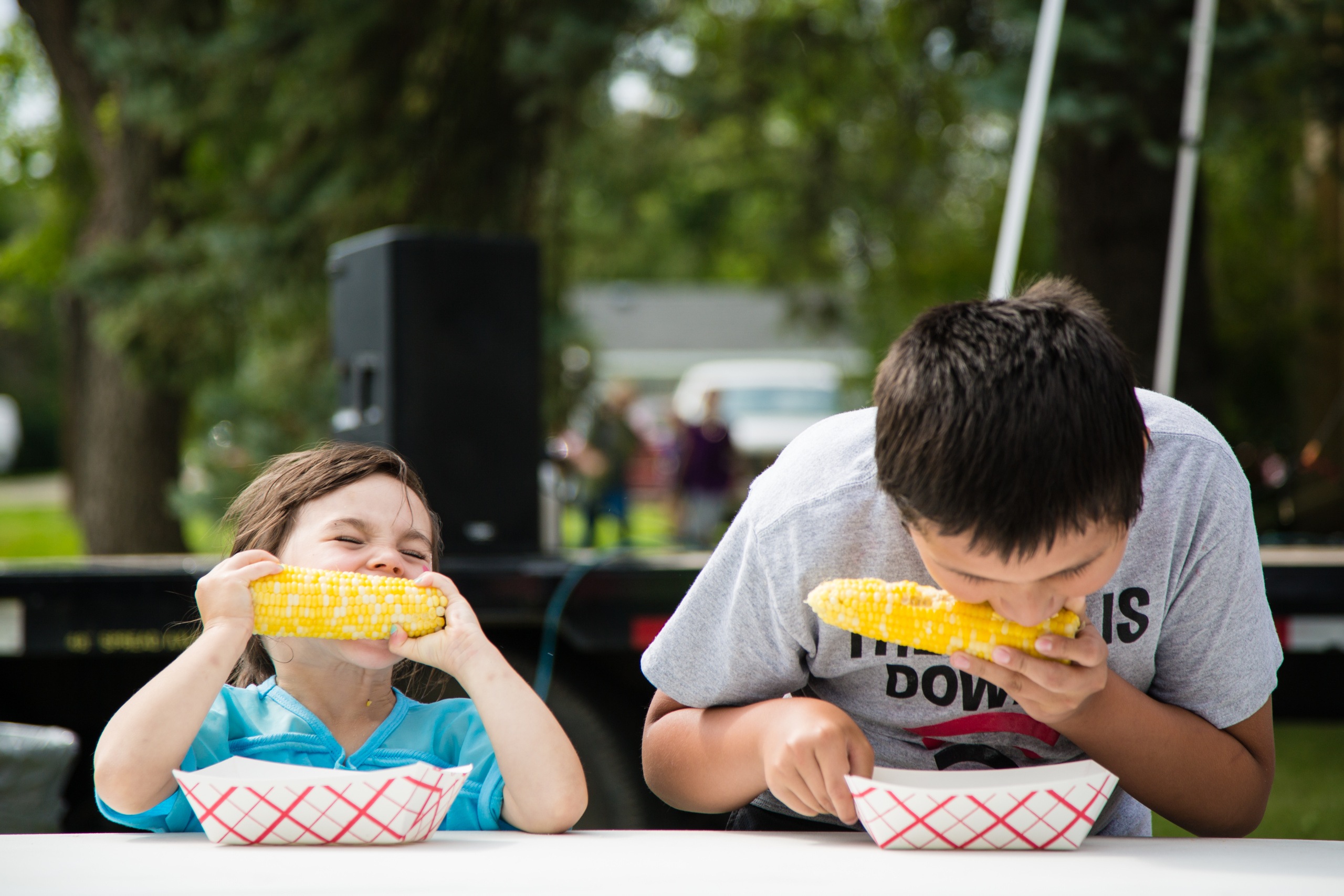 Boys Enjoying Emerado Corn Feed in Grand Forks County