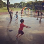 Children Playing in Water at University Park Splash Park in Grand Forks North Dakota