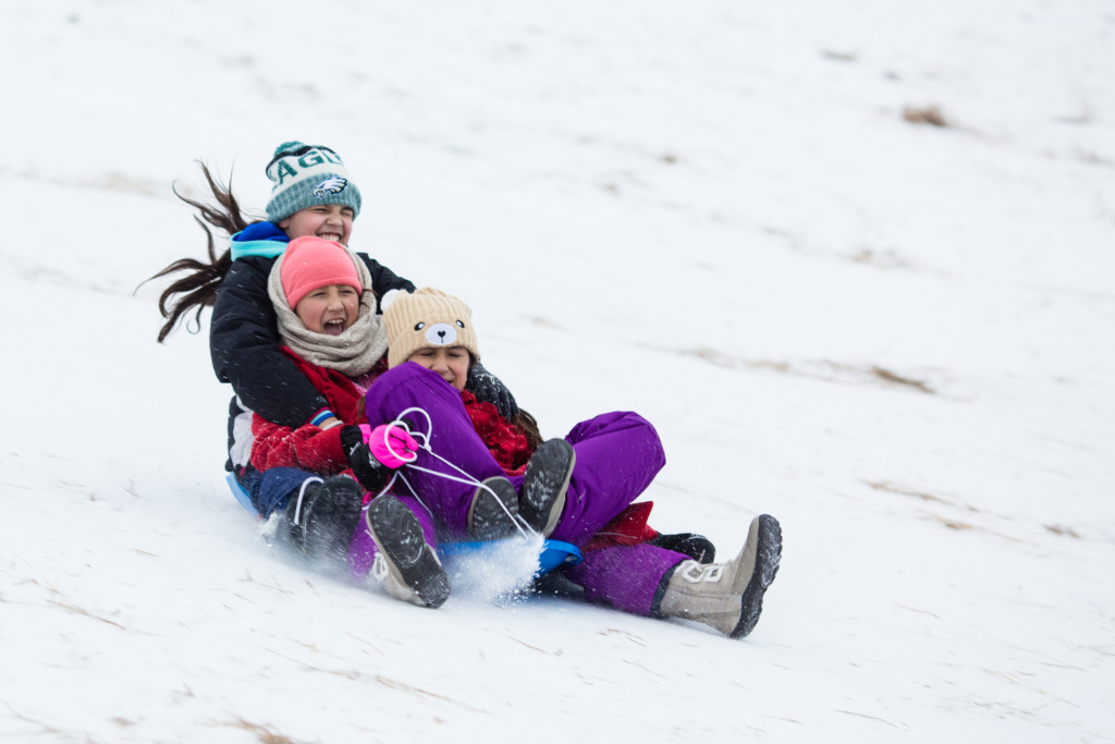 Girls Sledding Near Grand Forks Greenway in Grand Forks North Dakota