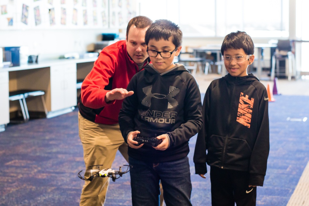Two Boys and Teacher Flying UAS Drones at Discovery Elementary in Best City to Raise a Family