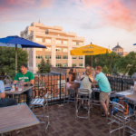 People hanging out on a rooftop bar in Grand Forks.