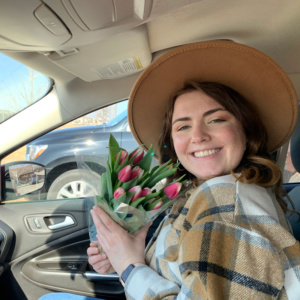 Emily holding tulips from All Seasons