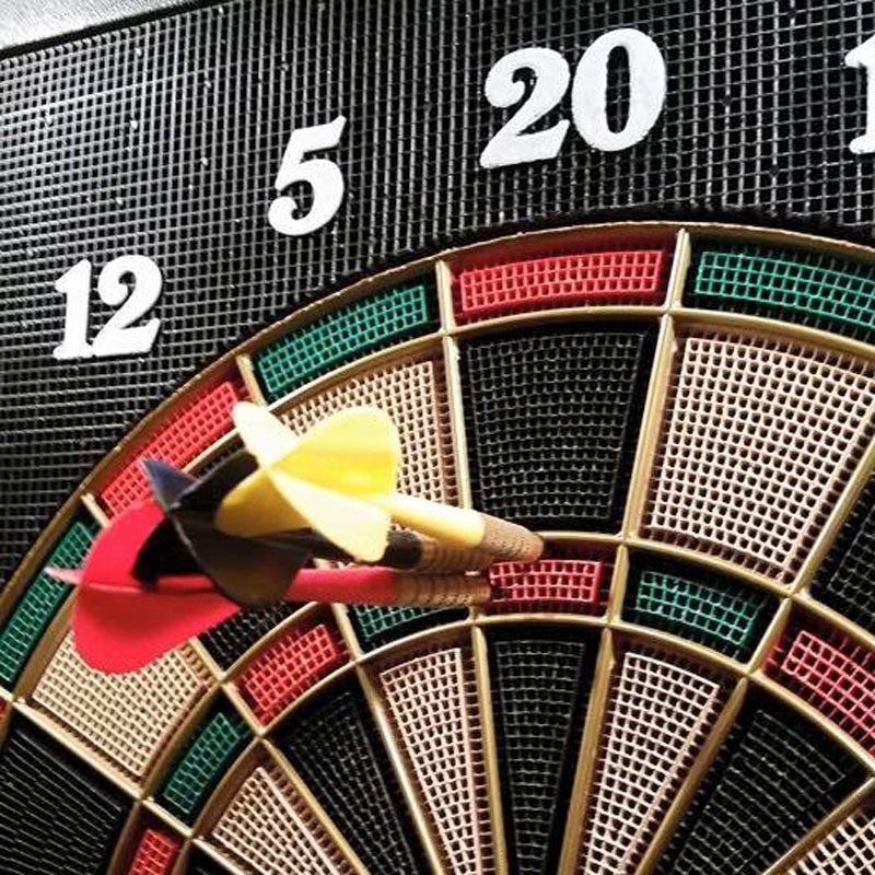 Three dart in a dart board as apart of 5 ways to shake off the 9-5 in Grand Forks