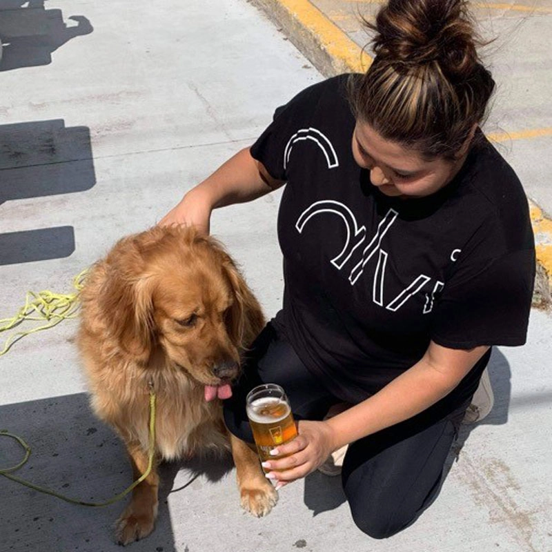 Alizjah and her dog at an outdoor patio