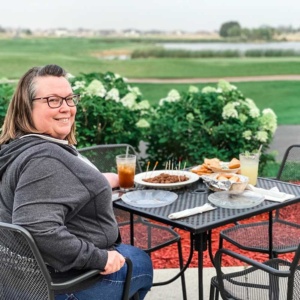 Lisa Johnson sitting at a Patio in Grand Forks while eating dinner