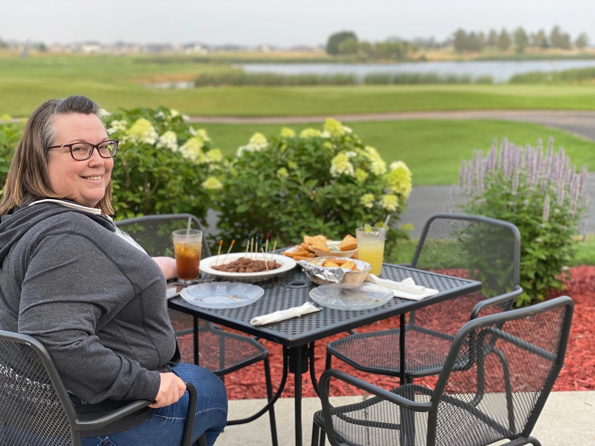 Lisa on the patio at King's Walk Golf Course