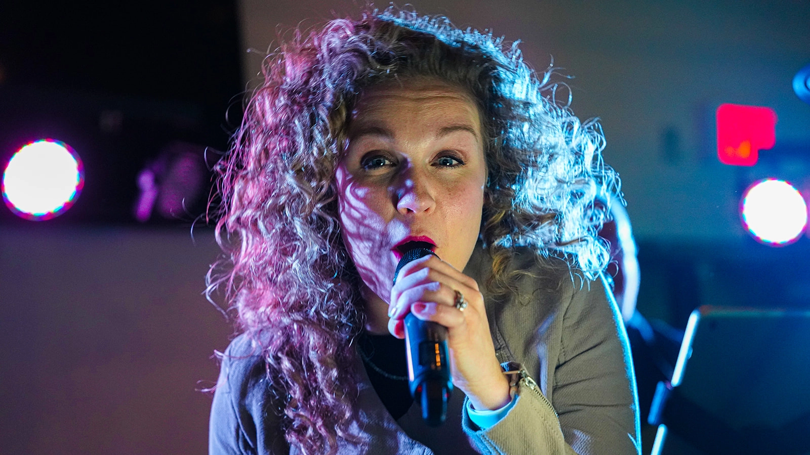 Woman singing under the lights