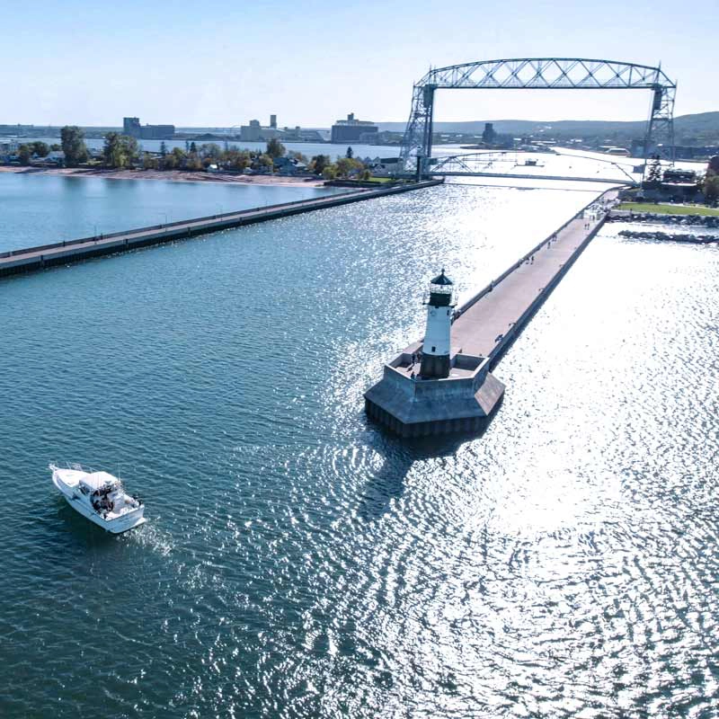 Lake in Duluth, MN with a boat and lighthouse