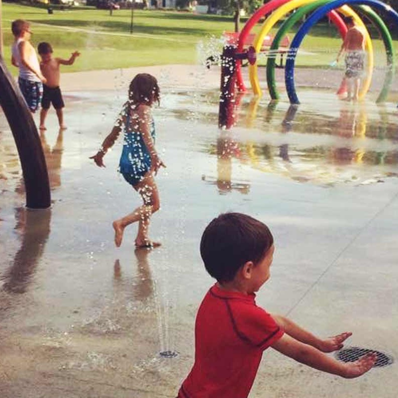 Children playing in splash park in Grand Forks