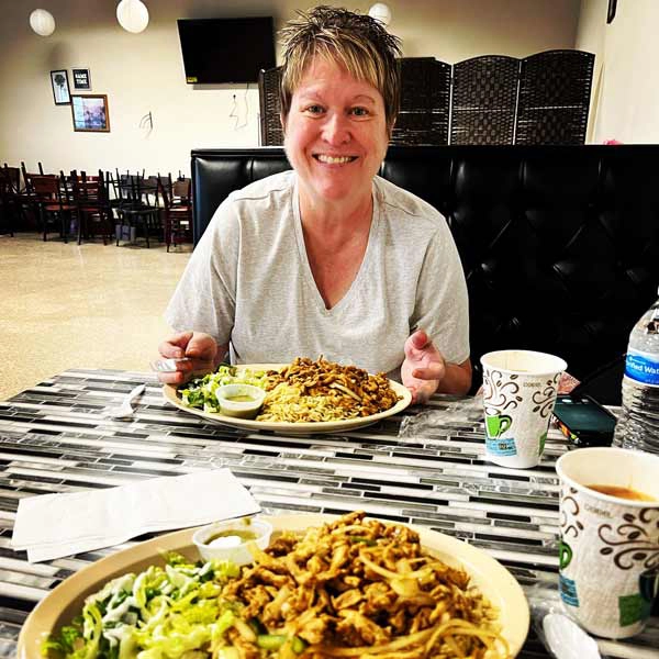 Woman at Safari enjoying her meal in Grand forks.