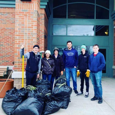 Group of Volunteers stand with trash bags in Grand Forks, ND