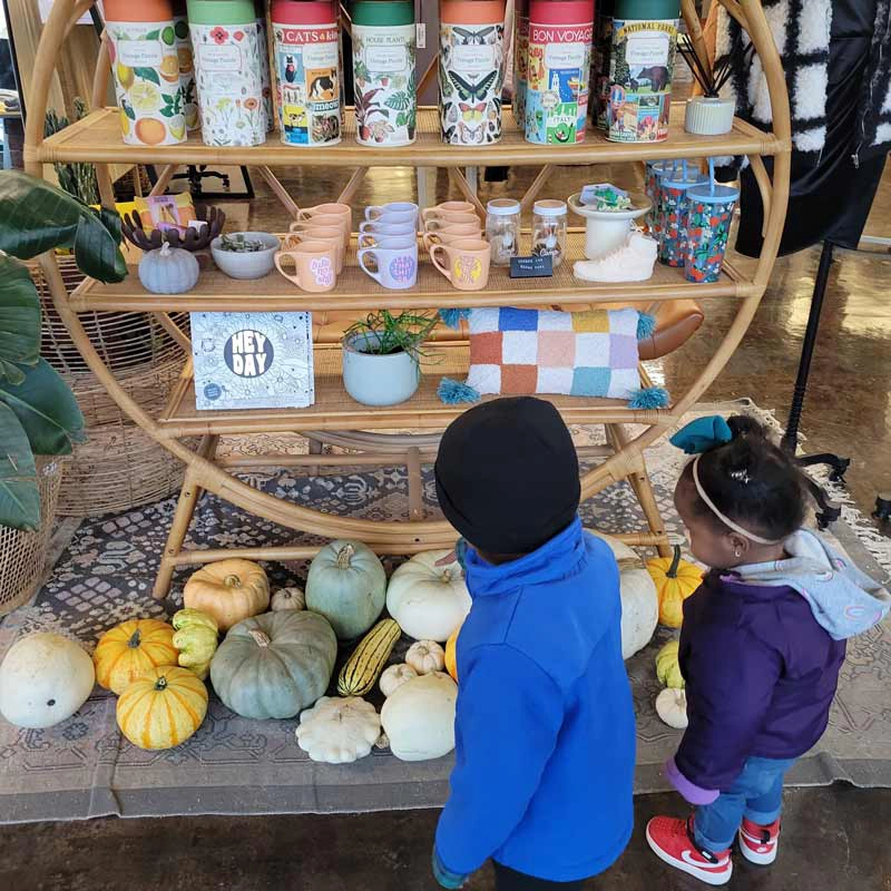 Two kids checking out a local shop in Grand Forks.