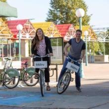 Couple riding bikes in Grand Forks, ND