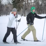 Couple skiing in Grand Forks in the winter.