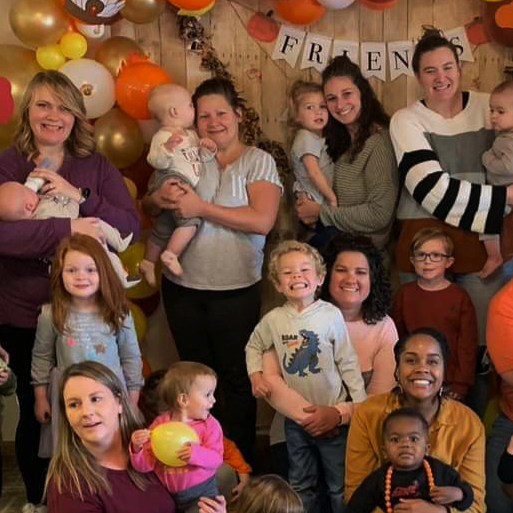 Group of moms and kids at party in Grand Forks, ND