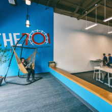 Women sitting in hammock chair in collaborative workspace in Grand Forks, ND