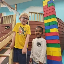 Two kids at the library in Grand Forks