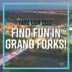 Graphic reads "Take our quiz. Find Fun in Grand Forks!" on top of photo of the city of Grand Forks, ND at Night