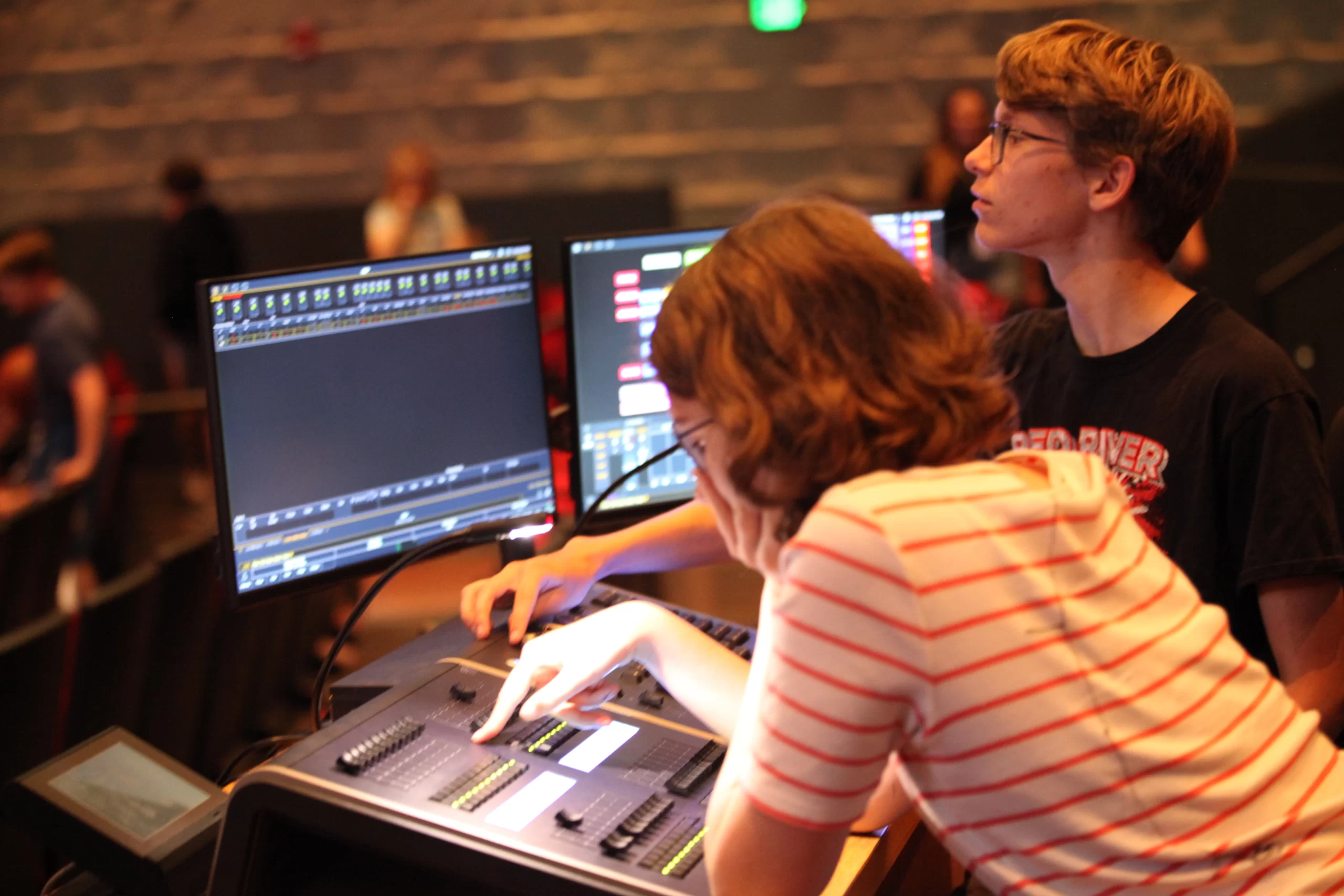 Two kids doing tech for SPA performing arts in Grand Forks.