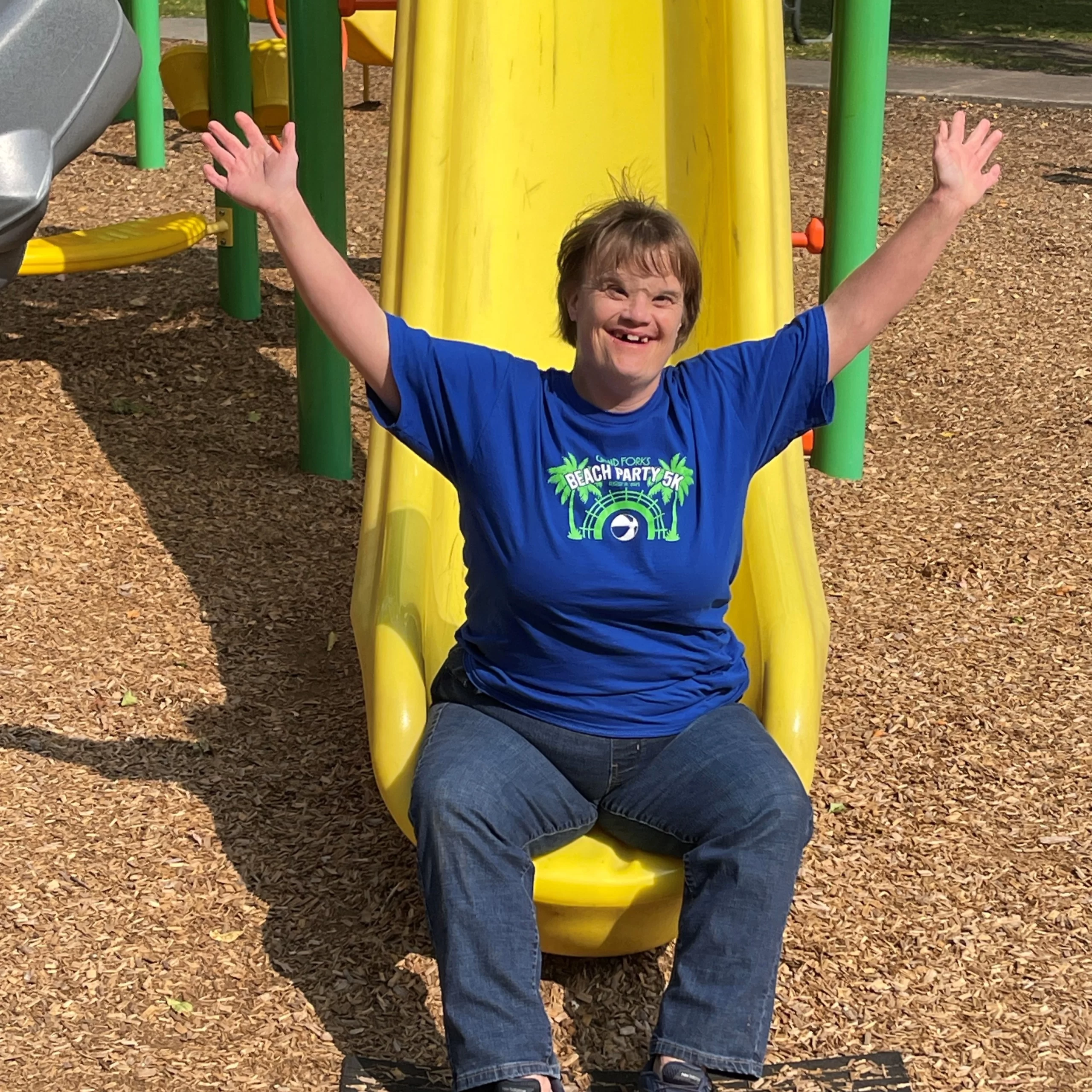 Yellow slide at park in Grand Forks.