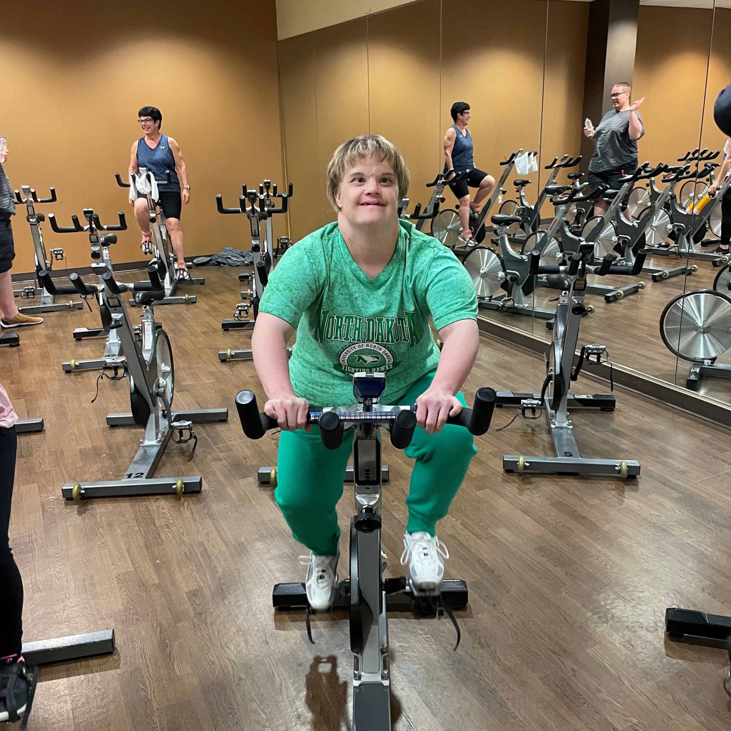 Author Erin on an EPIC spin bike in Grand Forks.