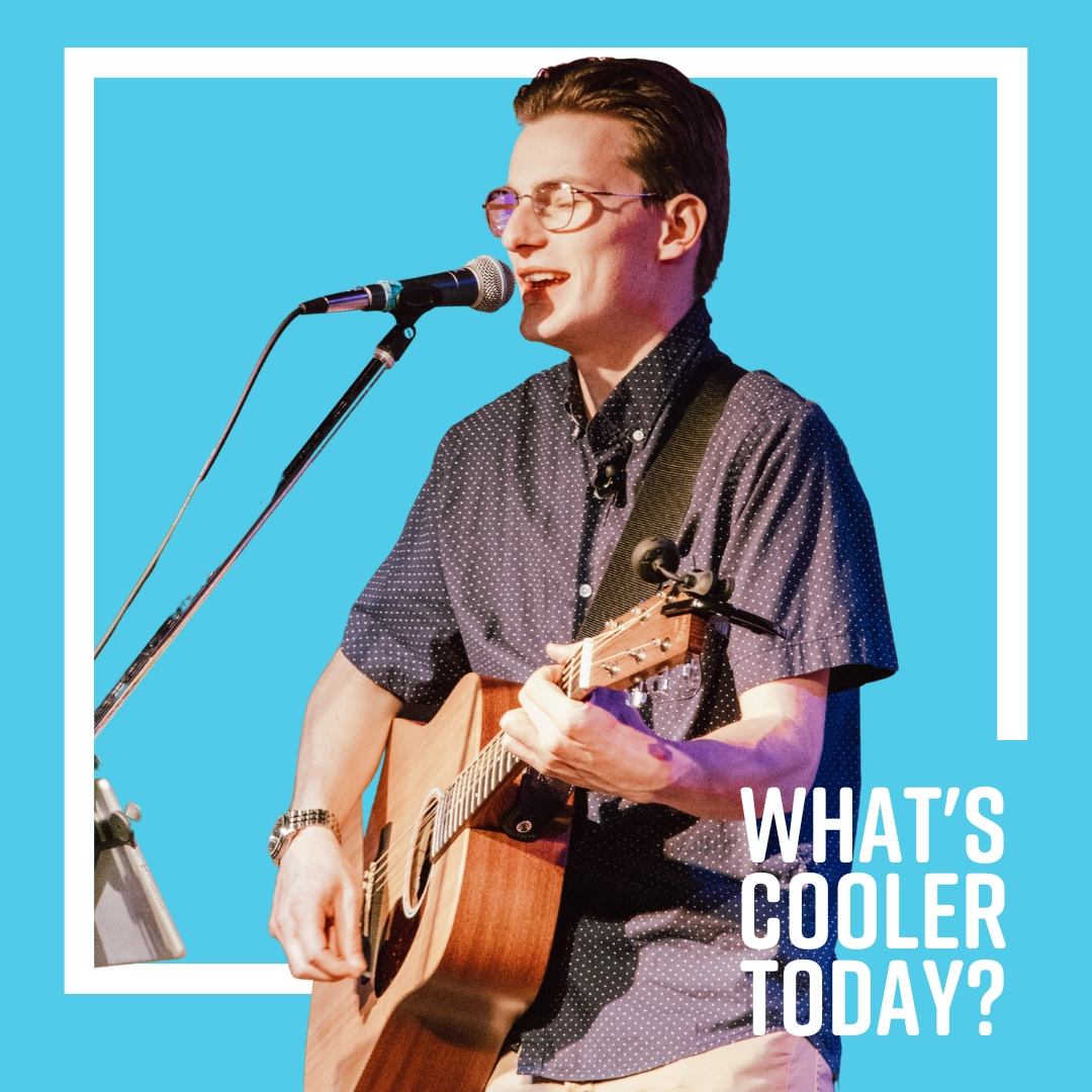 'What's Cooler Today?' Author Andy singing in front of blue background.