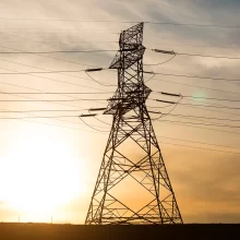 North Dakota Sunset in Grand Forks with powerlines silhouette.