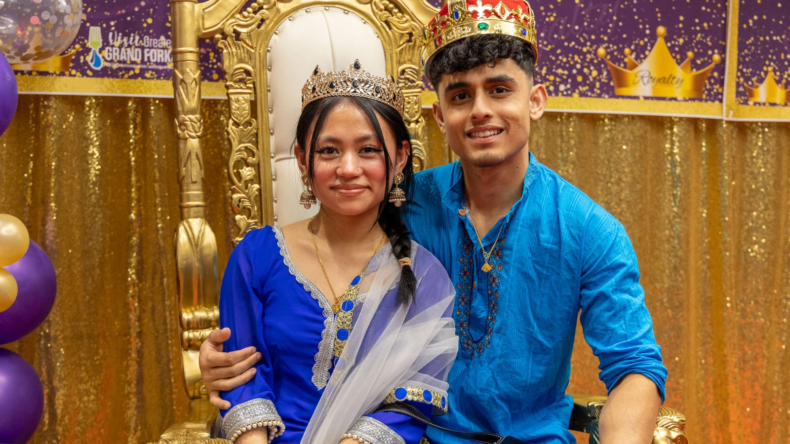 African culture night Royal Couple sits with crowns in Grand Forks.