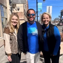 WCT writer Kenneth stands with two female Blue Zones employees while wearing a Grand Forks Blue zones shirt