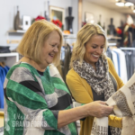 Two women browse the clothing rack at RH Standard in Grand Forks