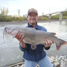 Wade Anderson showing off a nice Channel Catfish from the riverbank near the pedestrian walking bridge in East Grand Forks.