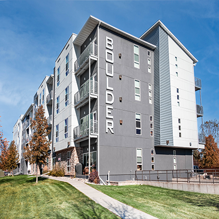 Boulder Apartments. Gray facade with asymmetrical designs.