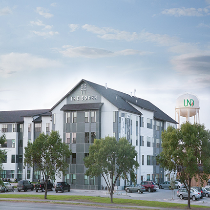 Exterior of Boden Apartments. Mulitshades of Grey make up the facade. Lots of windows.