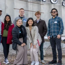 Group photo of seven ggfyp members in front of Cirrus after taking a tour of the business.
