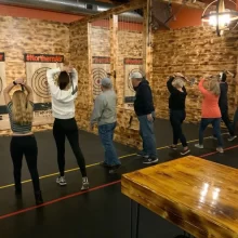 Image of a group axe throwing downtown grand forks.