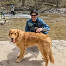 Author Adrian poses at Turtle River with his pup!