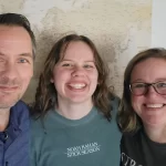 From left to right, Author Dave, then daughter Ashley, with wife Jen all smiling brightly at the camera for a selfie.