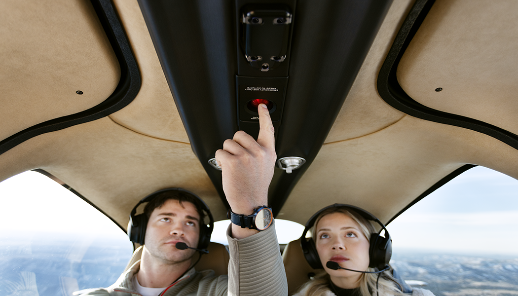 employees press a button inside the plane while flying