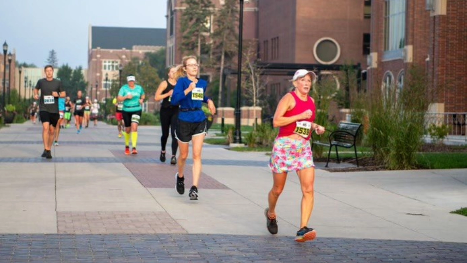 runners race across the main paths on UND campus