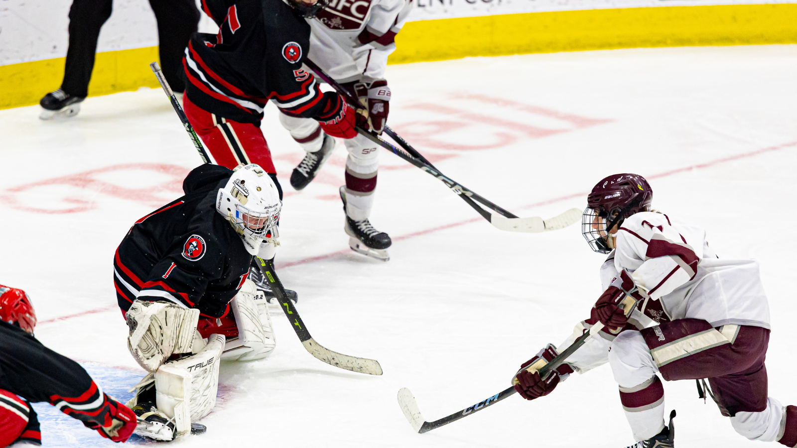 State Champion faceoff where a Central player shoots for the goal, but the goalie blocks it!