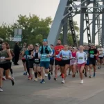 Runners race across the bridge