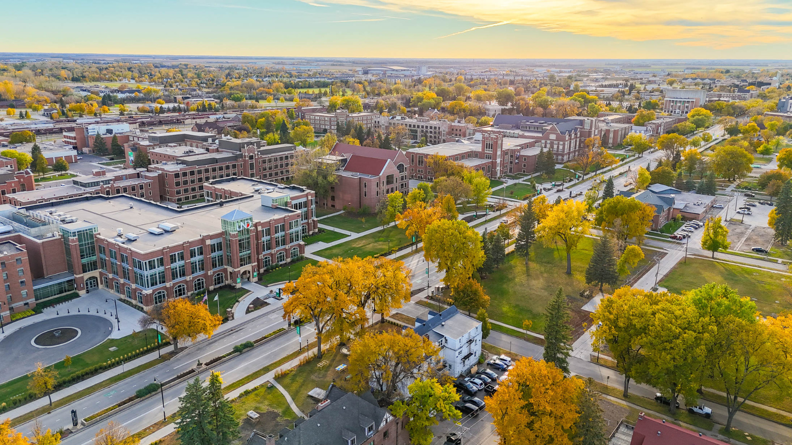 UND aerial shot during the fall with the sun shining over