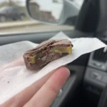 A close up of the inside of a chocolate covered pickle!