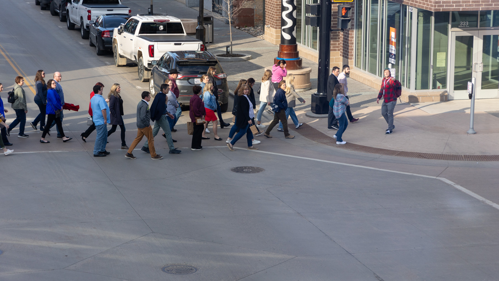 A photo of a group of site selectors receiving a downtown walking tour of Grand Forks!