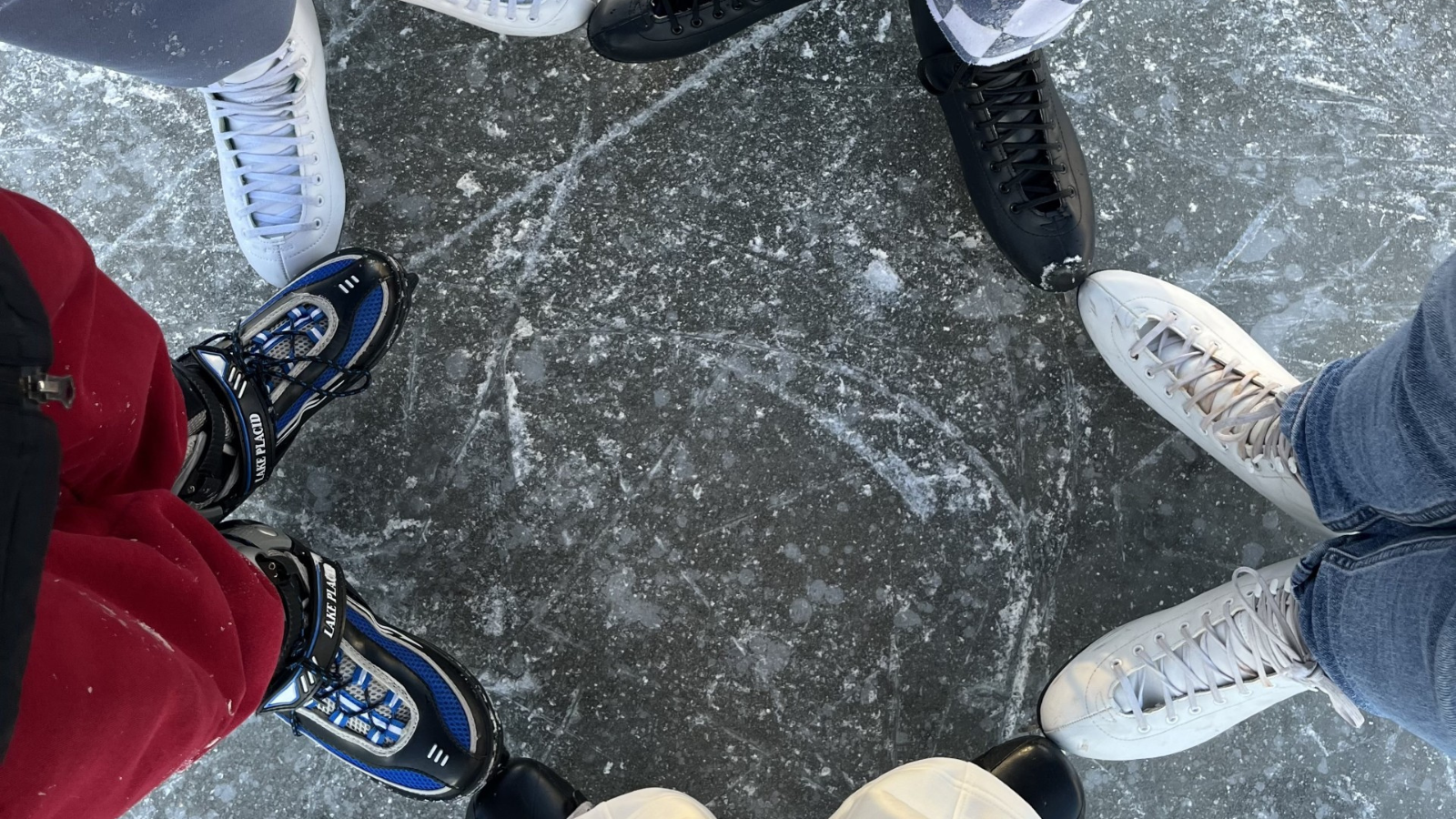 Madi Ice Rink Photo Author Madi and friends gather for a photo of their skates on an outdoor ice rink