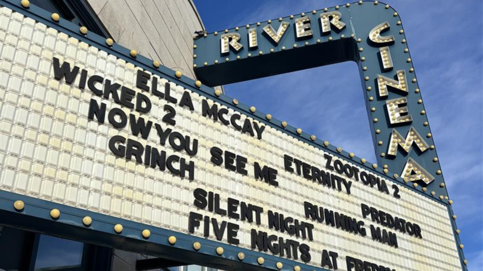 A picture of the sign outside river cinema showing all the movies on play