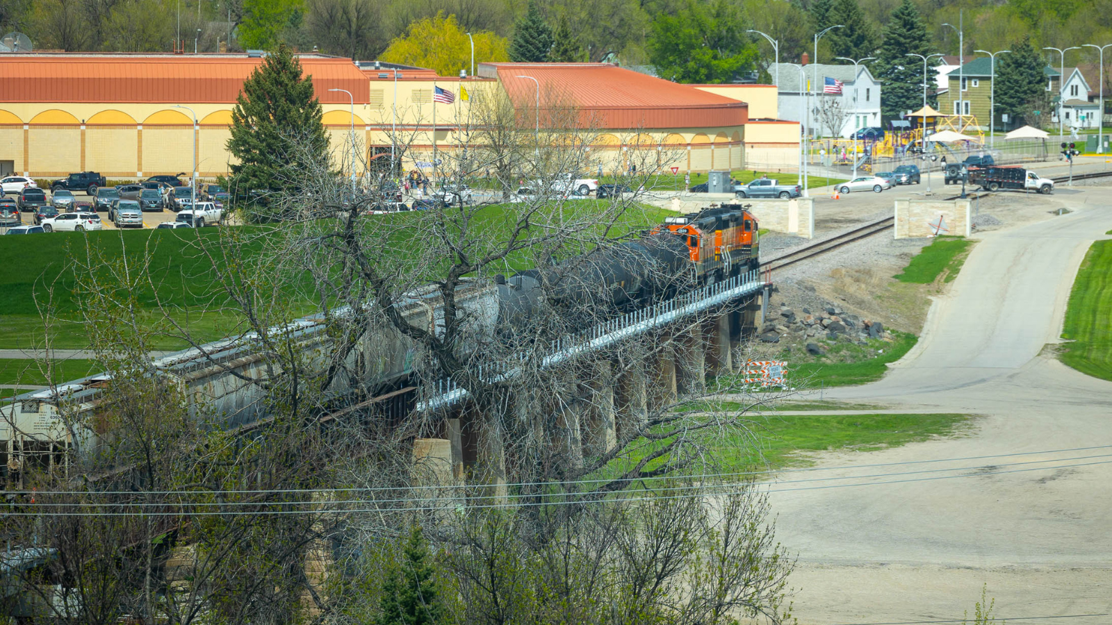 Train Crossing in Spring Photo A train rolls over the river into EGF on a spring day in Grand Forks