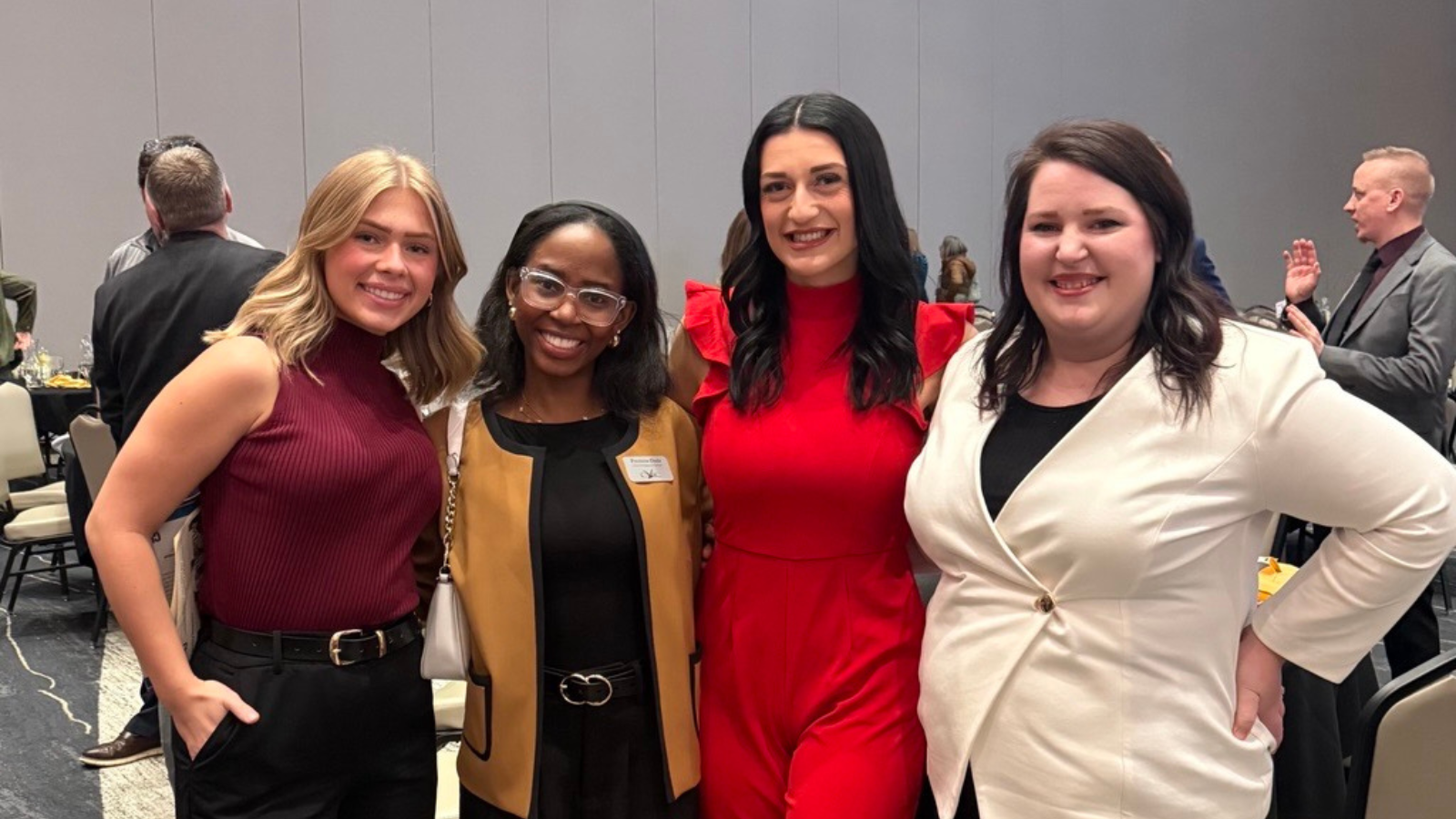 Chamber annual dinner group photo with author Precious smiling at the camera second from the left.