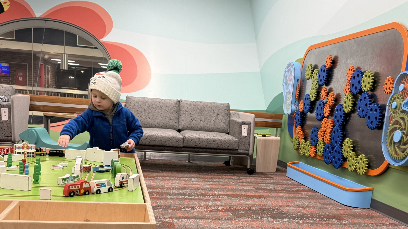Photo of Author Gabby's son playing in the upstairs section of the Grand Forks public library - how fun!